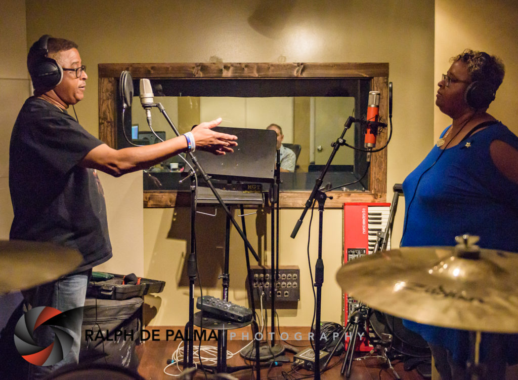 Brother and sister harmonizing backing vocals.